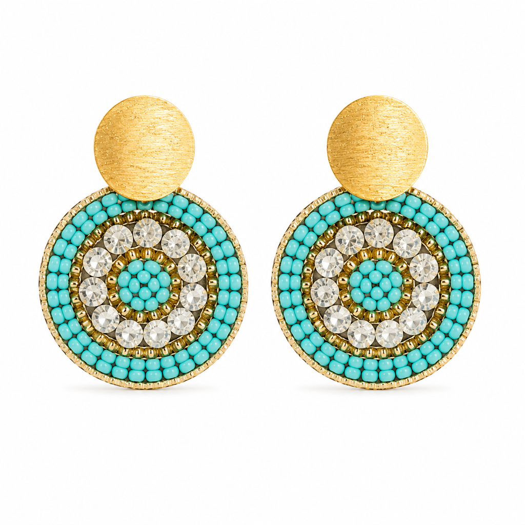 Turquoise and gold handmade beaded earrings crafted by Colombian artisans