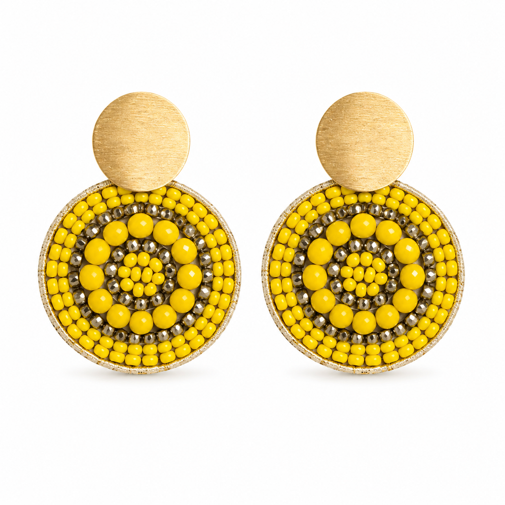 Yellow and gold handmade beaded earrings crafted by Colombian artisans