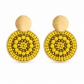 Yellow and gold handmade beaded earrings crafted by Colombian artisans